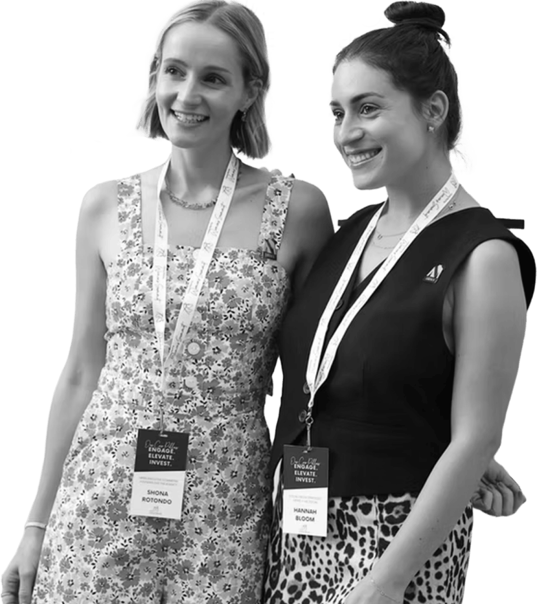 Two women with lanyards